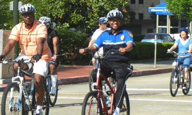 Mayor-President Holden (in blue) rides at the annual Mayor's Family Bike Ride through downtown Baton Rouge.