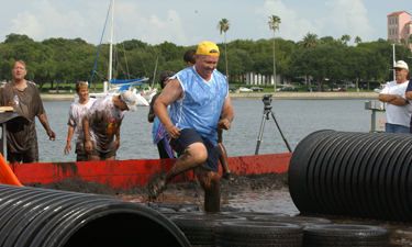 Harmon and other city staff compete against local youth in the St. Petersburg Mud Wars.