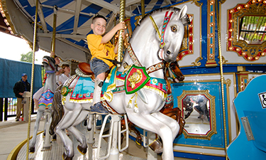 This accessible carousel at Clemyjontri Park in Virginia features chariots and a spinning tea cup that accommodate children in wheelchairs. Photo: Don Sweeney/Fairfax County Park Authority.