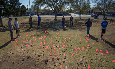 Each red flag marks the location of a littered cigarette butt found at this popular El Paso park.