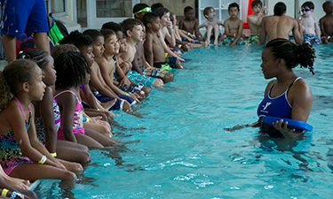 Children at the Carl E. Sanders Family YMCA at Buckhead, located in Atlanta, Georgia, participate in a recent World’s Largest Swimming Lesson.