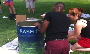 Volunteers at Baltimore, Maryland's Patterson Park turn donated oil drums into a public art installation during one of several civic hacking projects.