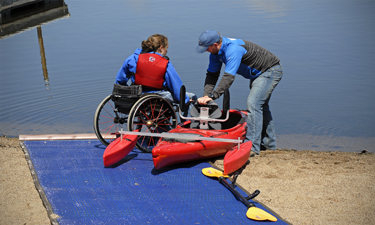 The author, an outdoor recreation educator with Minnesota’s Three Rivers Park District, tries out an adaptive kayak at Cleary Lake, just south of Minneapolis.
