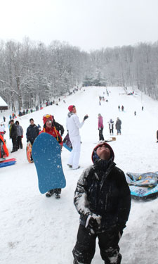 A young sledder at Chestnut Ridge Park and Campground enjoys the annual toboggan festival.
