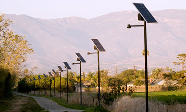 Solar lights line the edge of a trail in Visalia, California. During the day, panels store energy from the sun, which powers the LED lights at night.