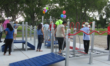 Residents explore the new senior playground at Carbide Park in LaMarque, Texas. The special equipment is intended to improve seniors’ agility and coordination through games and exercises.