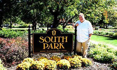 Jim O’Heir, known fondly for his role as Jerry Gergich in the hit television show “Parks and Recreation,” stands next to the entrance sign for South Park, Lawrence’s first established park.