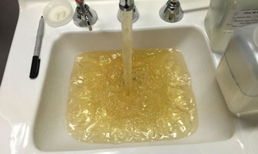 Contaminated water flows from a faucet at a Flint Hospital in October of 2015.