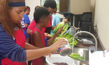 Super Chefs prepare a meal at the Grand Prairie, Texas, Parks, Arts and Recreation Department, demonstrating what they learned throughout the summer.