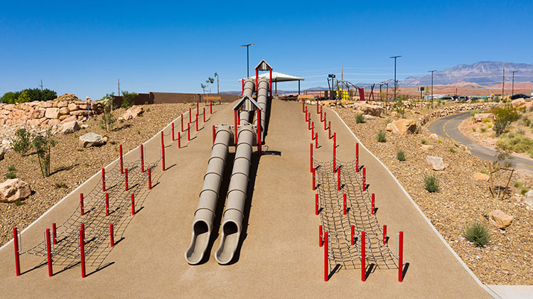 A slide on a natural playspace