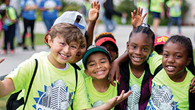 Group of children in matching camp expo shirts