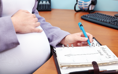photo of person taking notes in a notebook