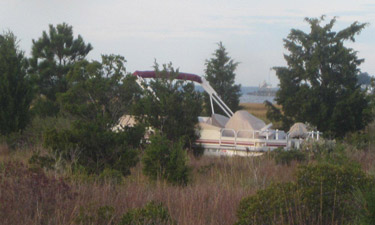 This boat was stranded aground more than 100 yards inland from the water in the marsh at Delaware Seashore State Park.
