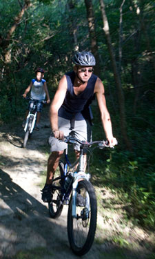 people enjoying mountain bike ride on trails