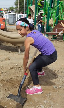 An El Sereno youth helps out at a community build day on the park site.