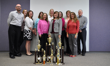 Slimmer NRPA staff members show off their hard-earned trophies.