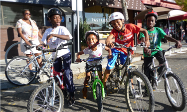 Young cyclists enjoy a ciclovia event in Berkeley, California.