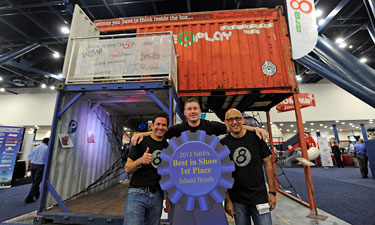 Exhibitors from Cre8Play won the 2013 Best in Show award for their extensive display featuring shipping crates and corrugated metal sheets fashioned into an innovative playground.