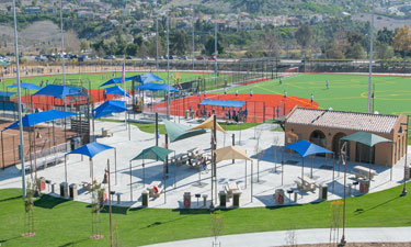 Thoughtfully placed shade structures, such as these in Carlsbad, California’s Alga Norte Community Park, appeal to visitors visually and make visits during hot weather more comfortable.