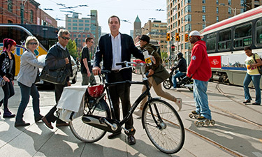Gil Penalosa walks the walk — or, in this case, cycles it — using his bicycle to traverse Toronto’s busy, vibrant streets. 