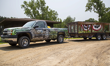This clever Truck Farm, which features a robust garden towed on a flatbed trailer, visits Genesee County Parks Summer Playground Program to teach children about where their food comes from.