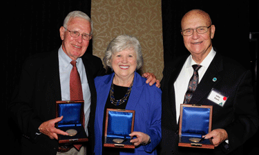 From left, Barry Sanford Tindall, Beverly D. Chrisman and John Davis show off their Pugsley Awards during the AAPRA Banquet in Houston, Texas, on October 10, 2013.